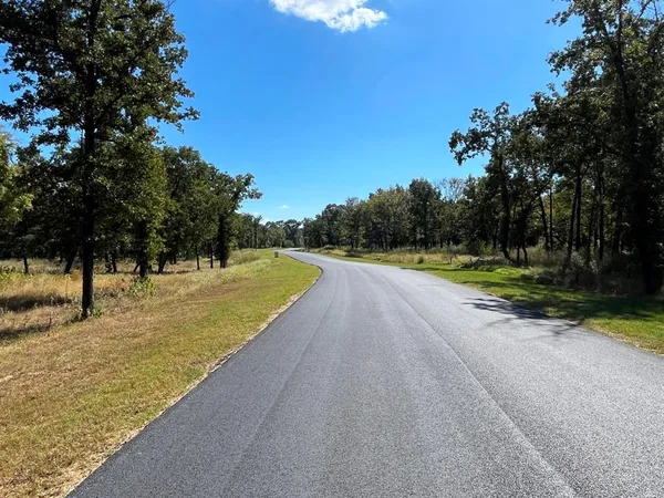 a view of a swimming pool and a yard