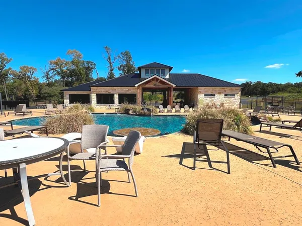 a view of a chairs and table in a patio