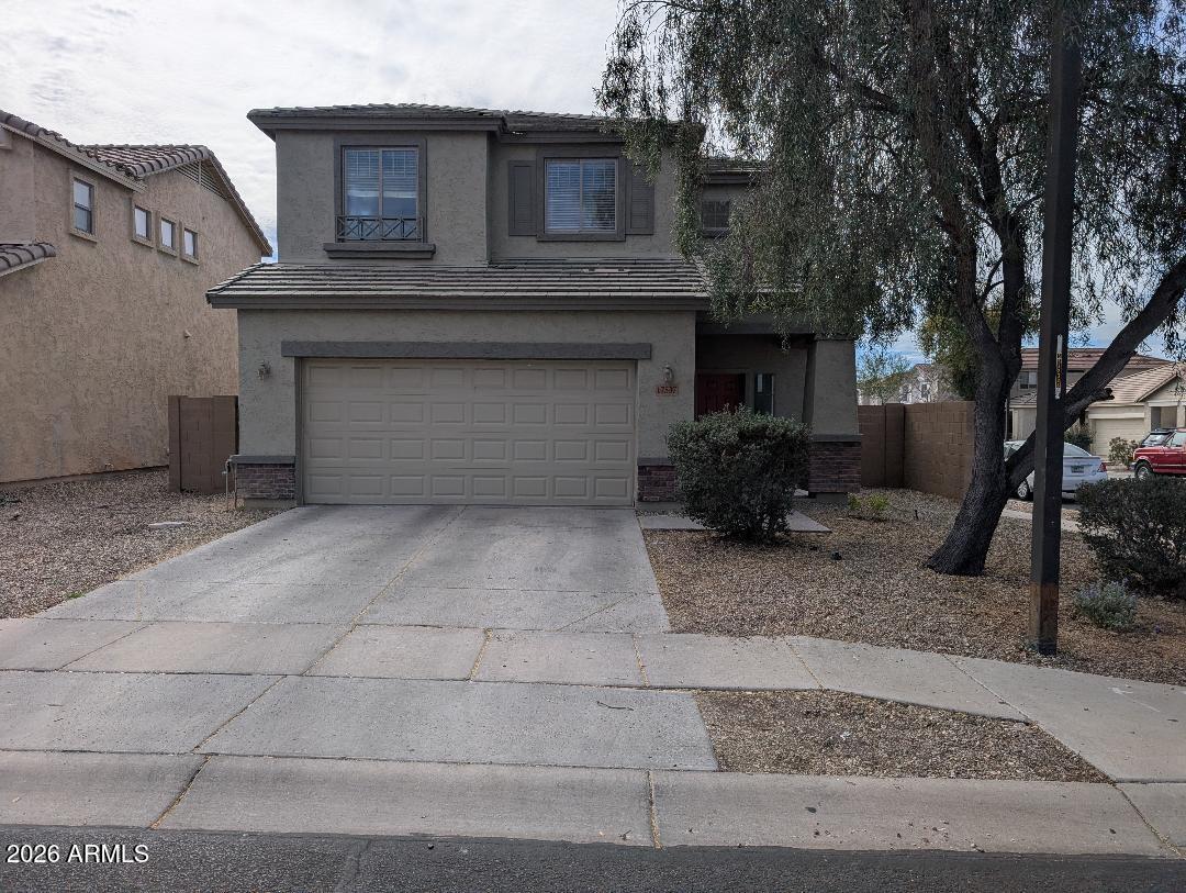 17537 West Banff Lane Surprise, AZ 85388 - Photo 2 of 11 a front view of a house with garage