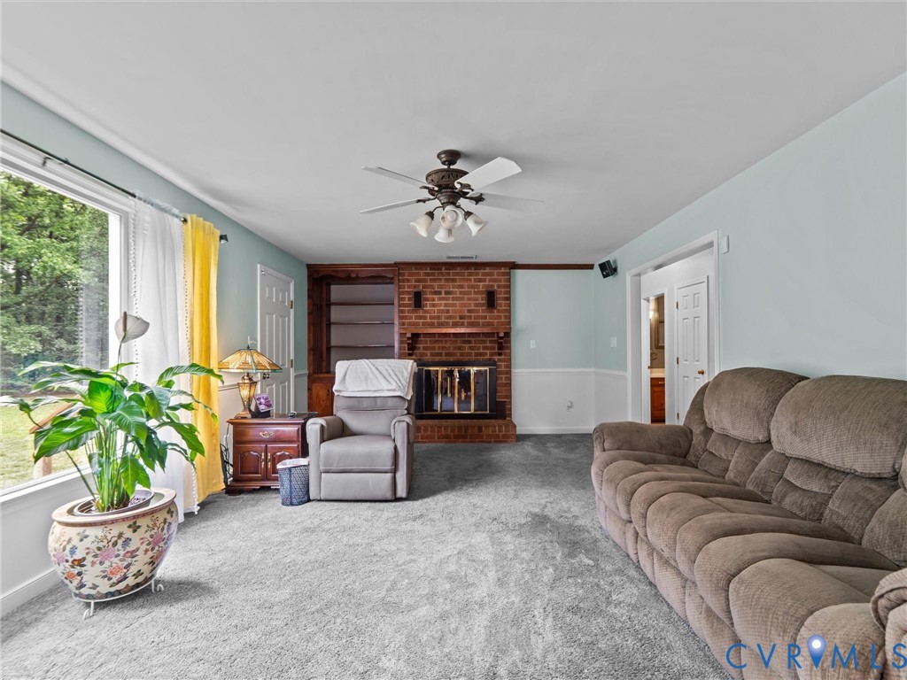 3420 State Rte 656 Powhatan, VA 23139 - Photo 8 of 37 a living room with furniture and a large window