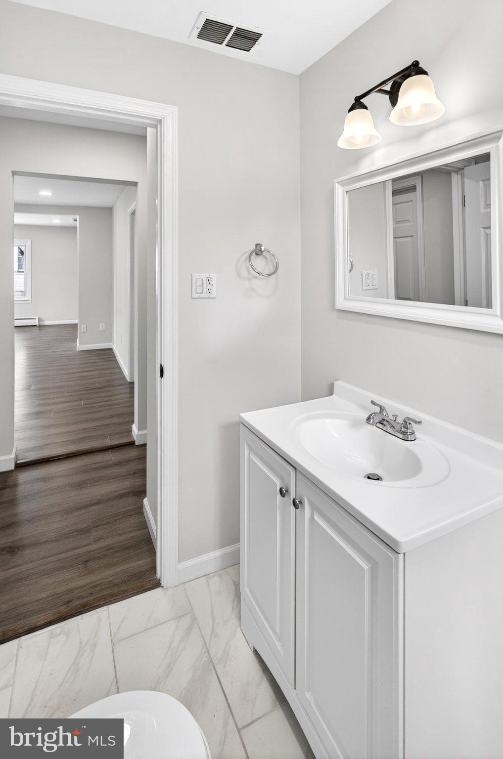 9081 Dumhart Road Laurel, MD 20723 - Photo 32 of 45 Modern bathroom with sleek finishes.
