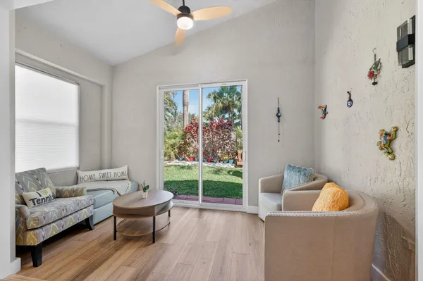 a living room with furniture and a large window