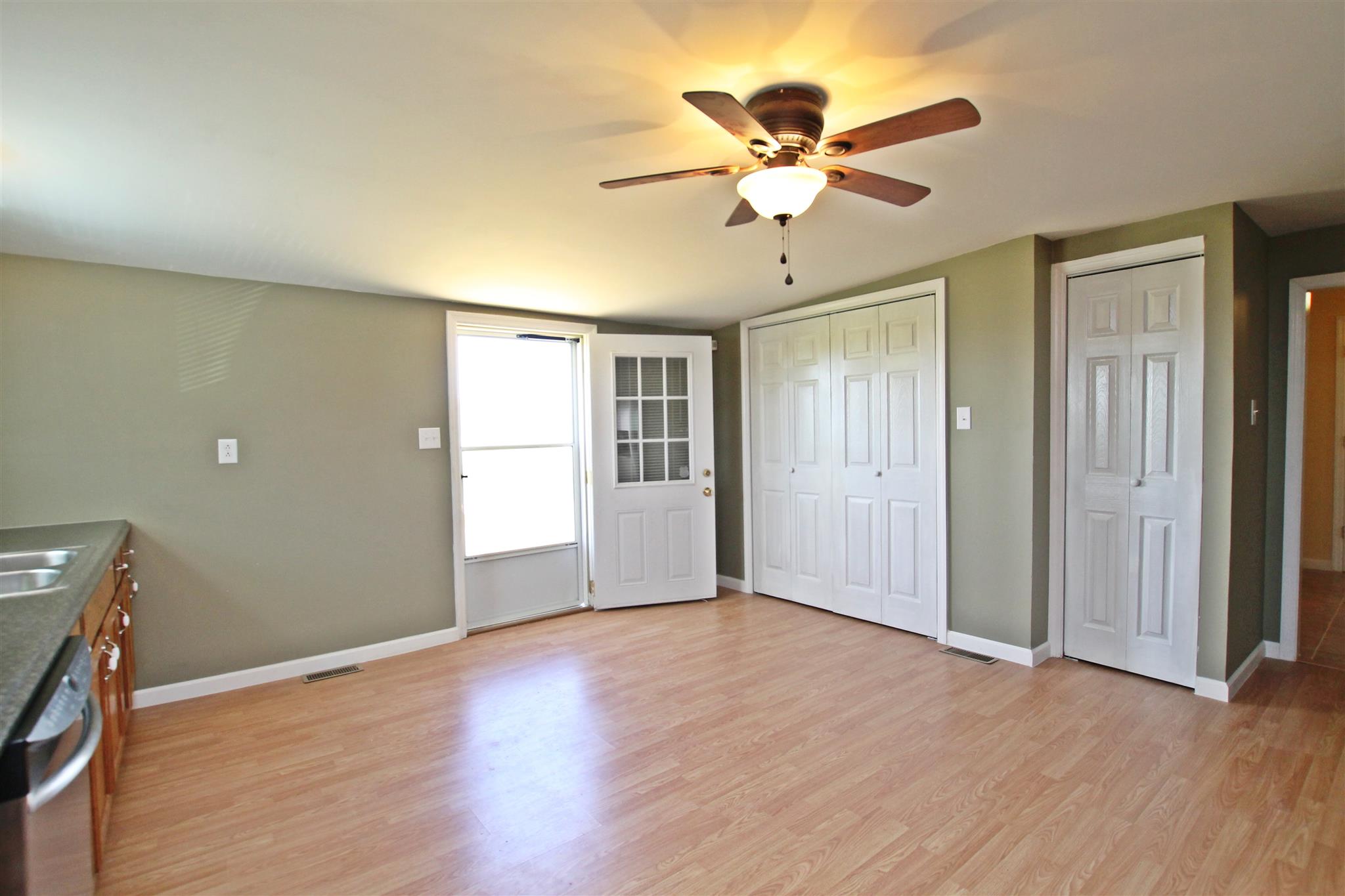 4323 Dot Road Springfield, TN 37172 - Photo 8 of 24 a view of an empty room with window and wooden floor