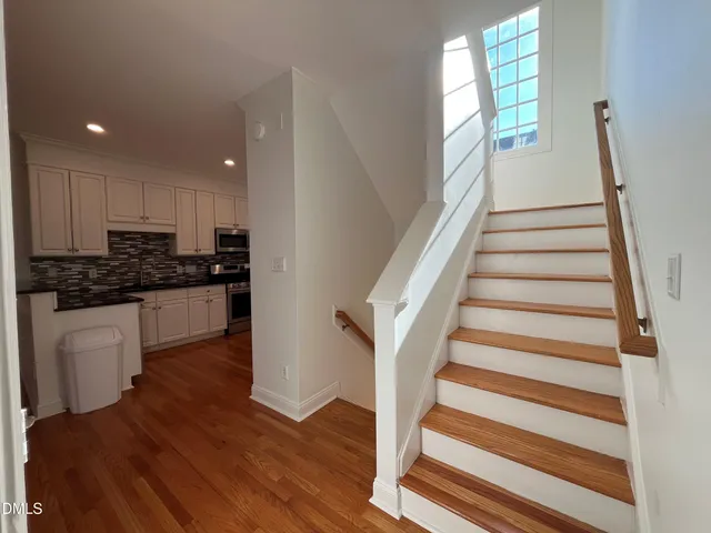 a kitchen with sink and cabinets