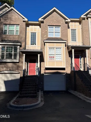 a front view of a house with a garage