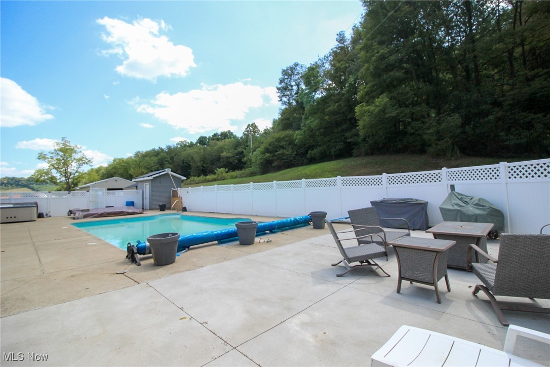 1798 Campbell Road Southwest New Philadelphia, OH 44663 - Photo 36 of 50 View of pool with a patio area
