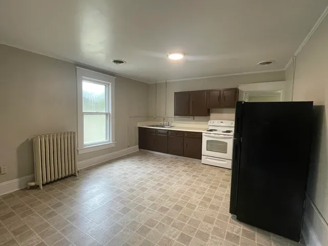 a kitchen with stainless steel appliances a refrigerator and a sink