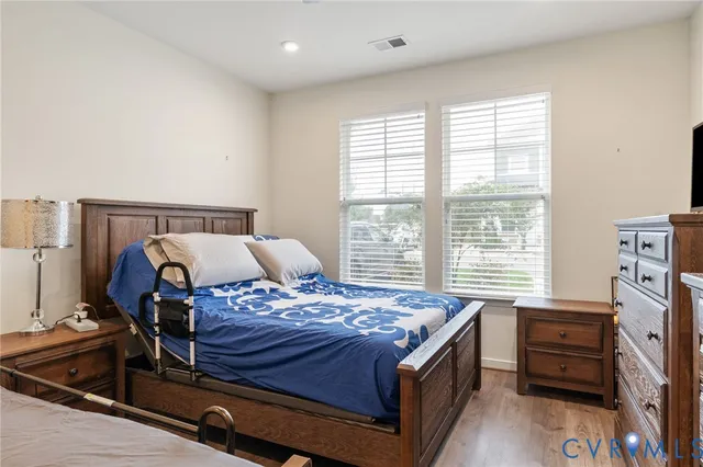 a bedroom with a bed and a table