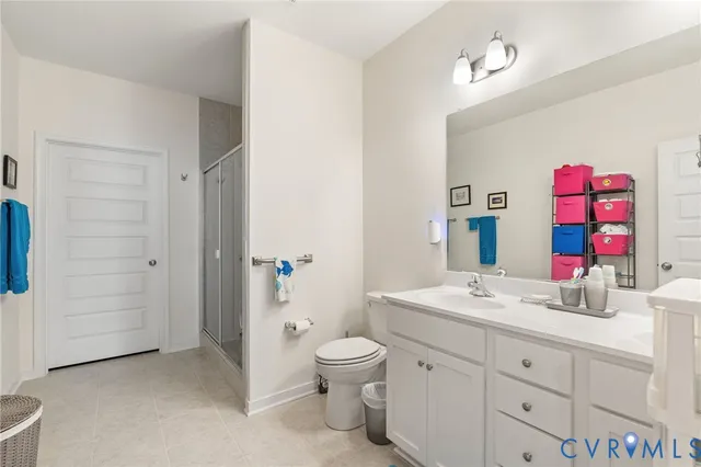a bathroom with a sink vanity mirror and toilet
