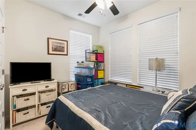 a view of a livingroom with furniture and a flat screen tv