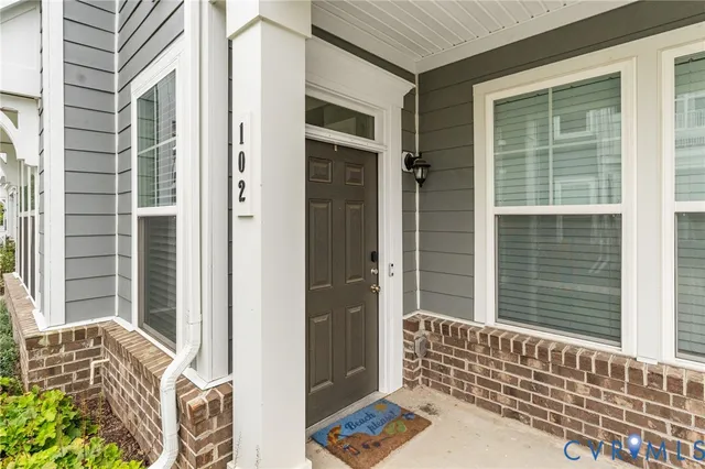 a view of a door and a window