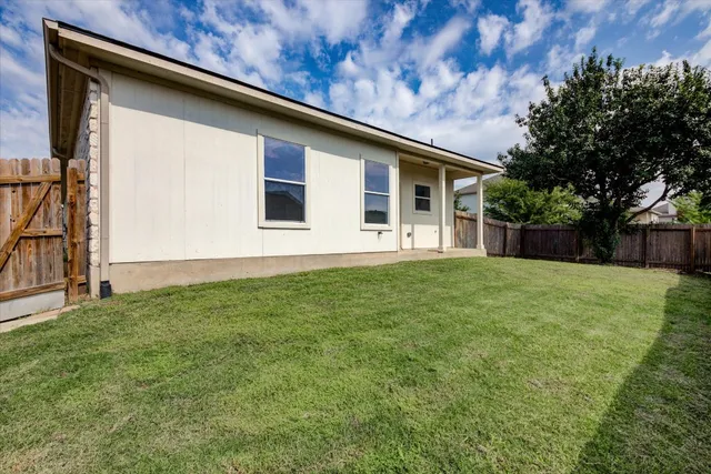 a backyard of a house with lots of green space