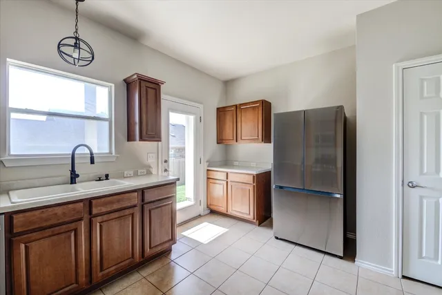 a kitchen with stainless steel appliances granite countertop a stove sink and microwave