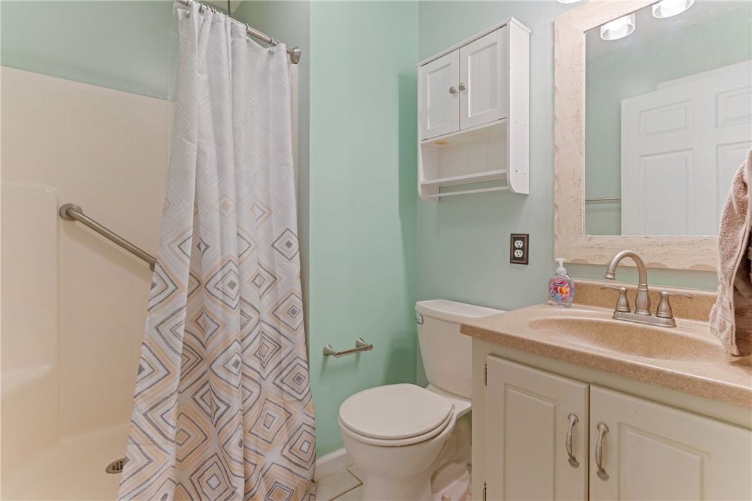404 Davis Road Liberty, SC 29657 - Photo 16 of 39 A compact bathroom with practical fixtures features a clean bathtub, toilet, and vanity sink.