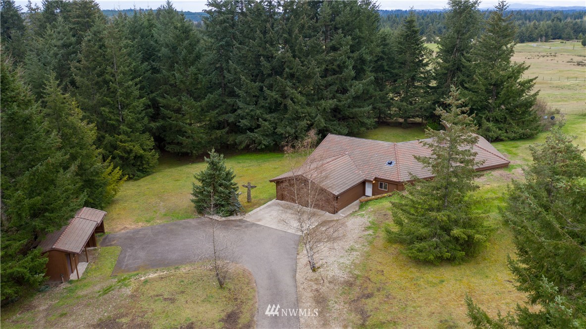 7425 Bordeaux Road Southwest Olympia, WA 98512 - Photo 1 of 25 an aerial view of a house with a yard