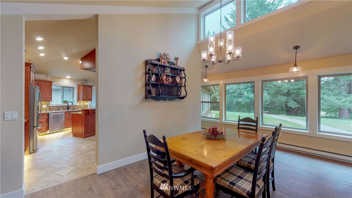 7425 Bordeaux Road Southwest Olympia, WA 98512 - Photo 8 of 25 a view of a dining room with furniture window and outside view
