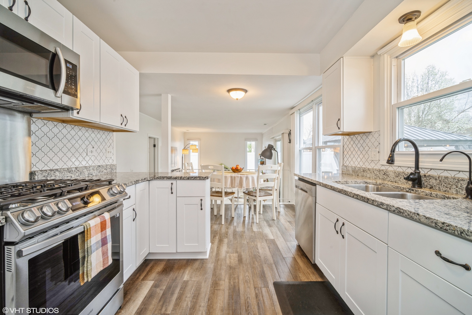 1145 John Drive Hoffman Estates, IL 60169 - Photo 11 of 36 a kitchen with a sink stove and cabinets