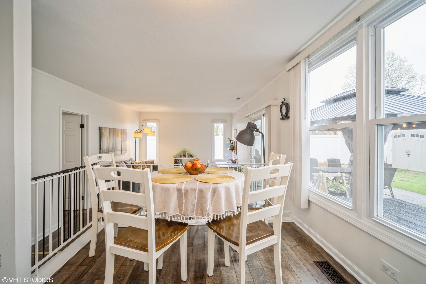 1145 John Drive Hoffman Estates, IL 60169 - Photo 12 of 36 a dining room with furniture a flat screen tv and outdoor view