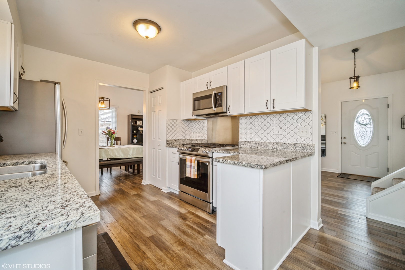 1145 John Drive Hoffman Estates, IL 60169 - Photo 13 of 36 a kitchen with granite countertop a stove and a sink