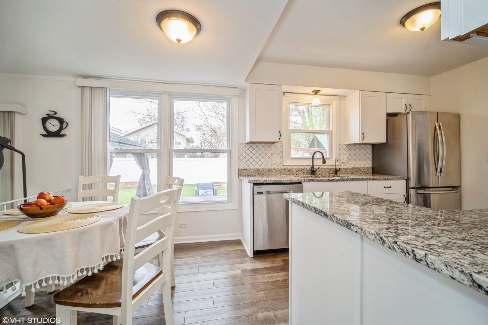 1145 John Drive Hoffman Estates, IL 60169 - Photo 14 of 36 a kitchen with stainless steel appliances granite countertop a sink stove and refrigerator