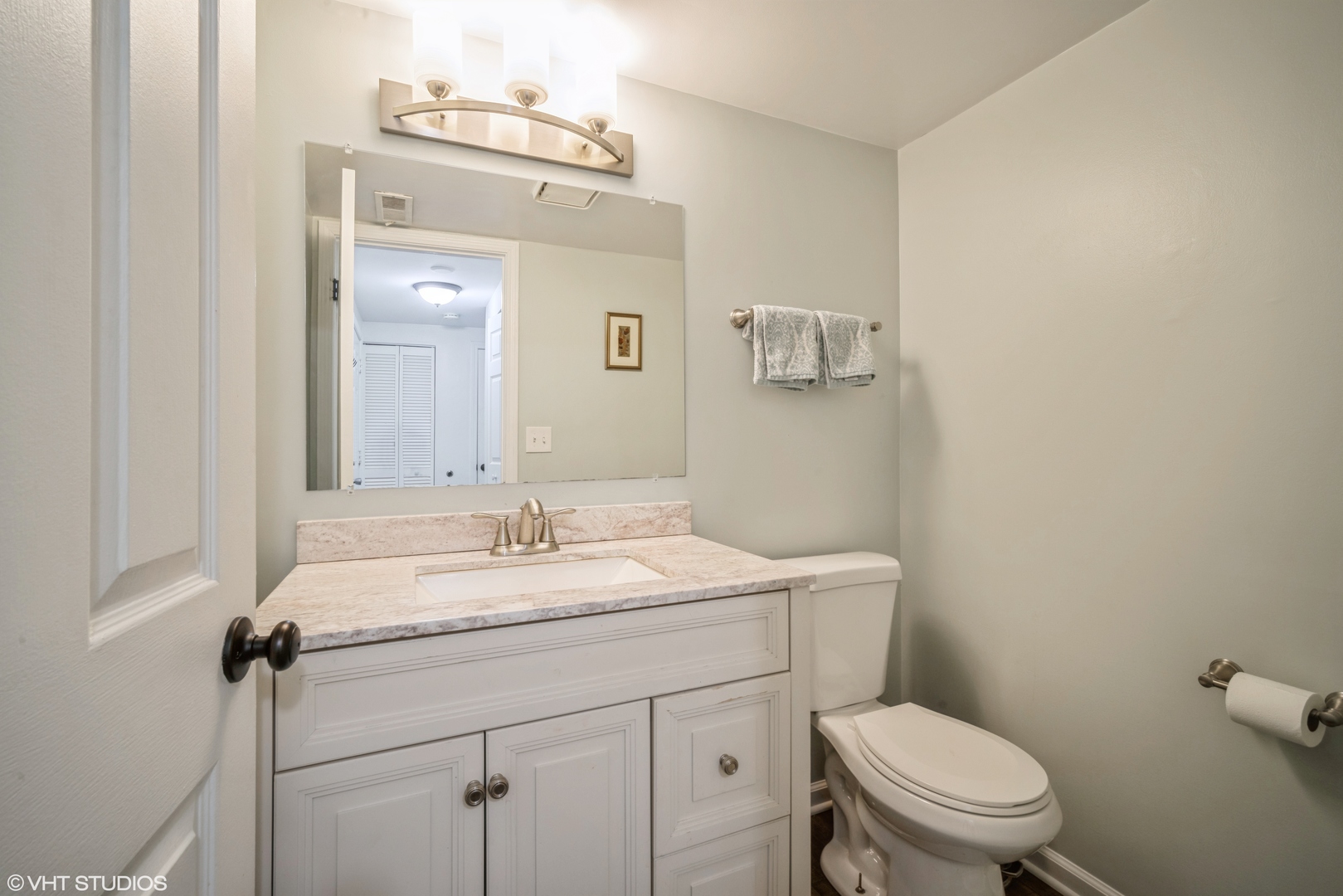 1145 John Drive Hoffman Estates, IL 60169 - Photo 18 of 36 a bathroom with a granite countertop sink mirror vanity and toilet