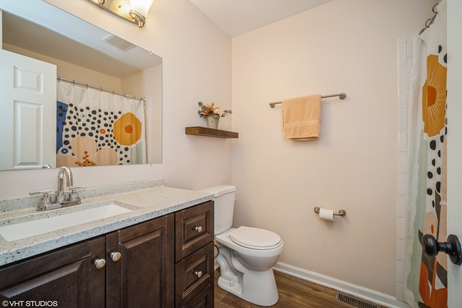 1145 John Drive Hoffman Estates, IL 60169 - Photo 23 of 36 a bathroom with a granite countertop sink mirror vanity and toilet
