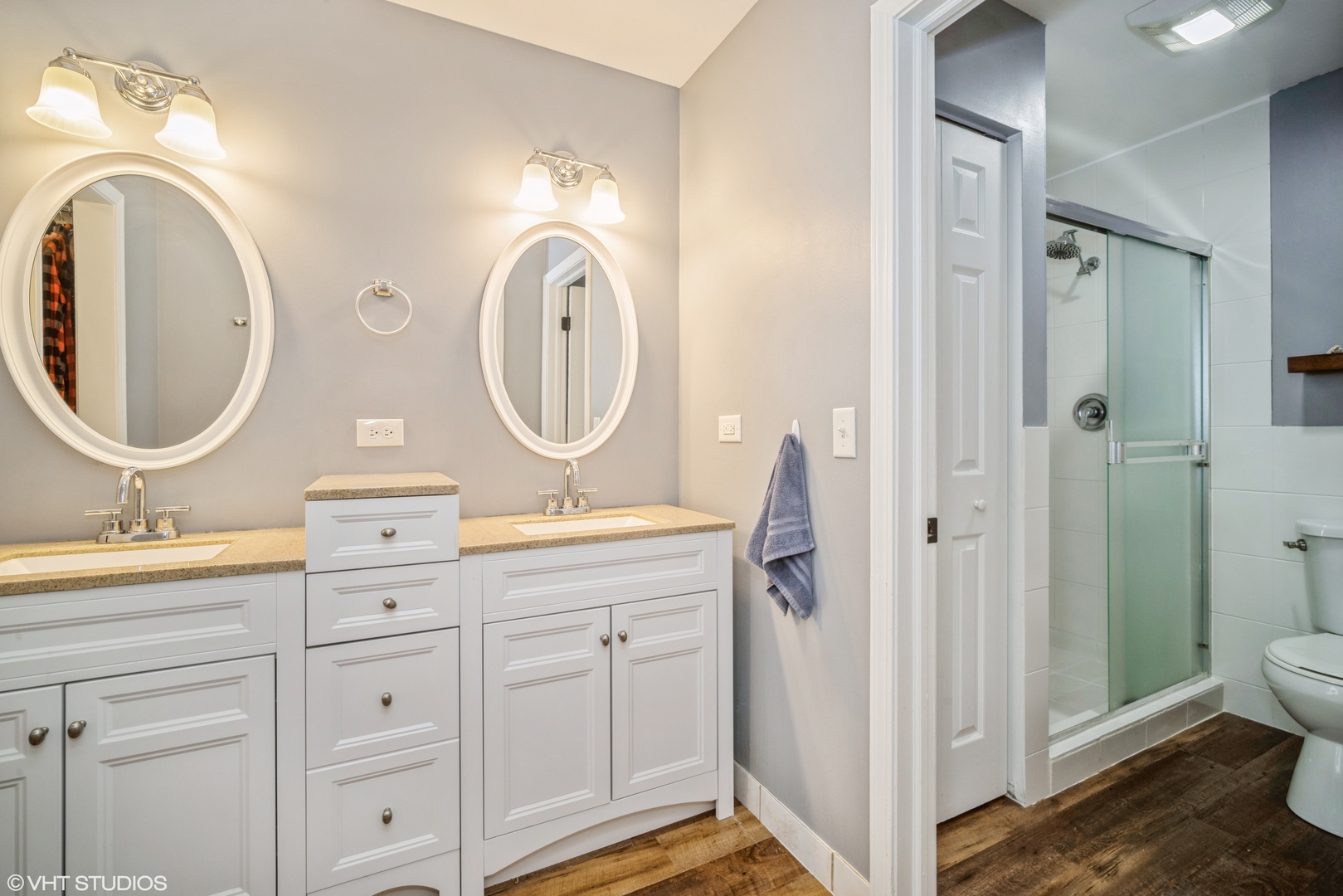 1145 John Drive Hoffman Estates, IL 60169 - Photo 27 of 36 a bathroom with a double vanity sink mirror and toilet