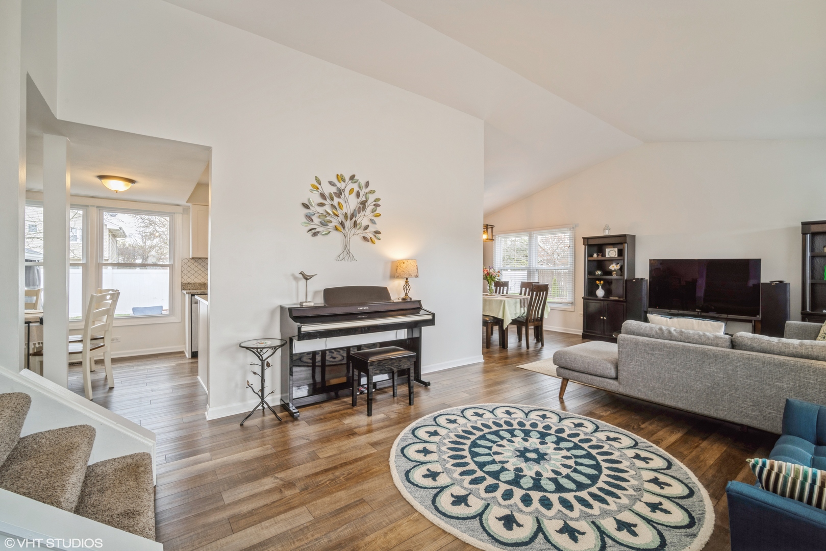 1145 John Drive Hoffman Estates, IL 60169 - Photo 3 of 36 a living room with furniture and a flat screen tv