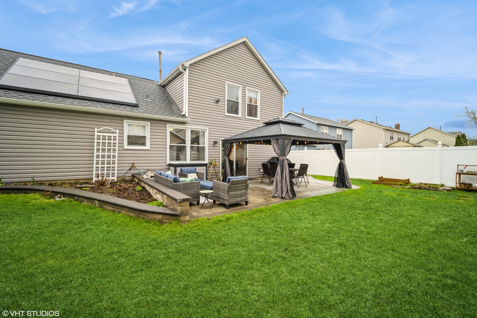 1145 John Drive Hoffman Estates, IL 60169 - Photo 34 of 36 a view of a house with backyard and sitting area