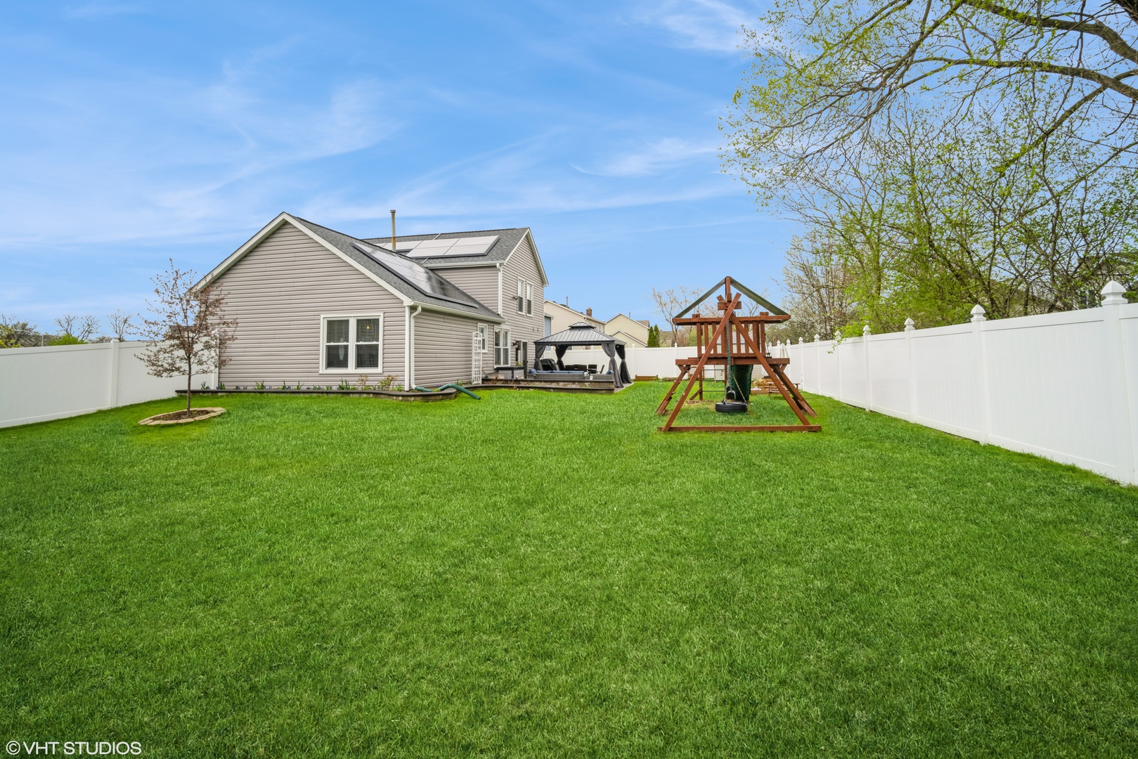 1145 John Drive Hoffman Estates, IL 60169 - Photo 35 of 36 a view of a house with a yard and sitting area