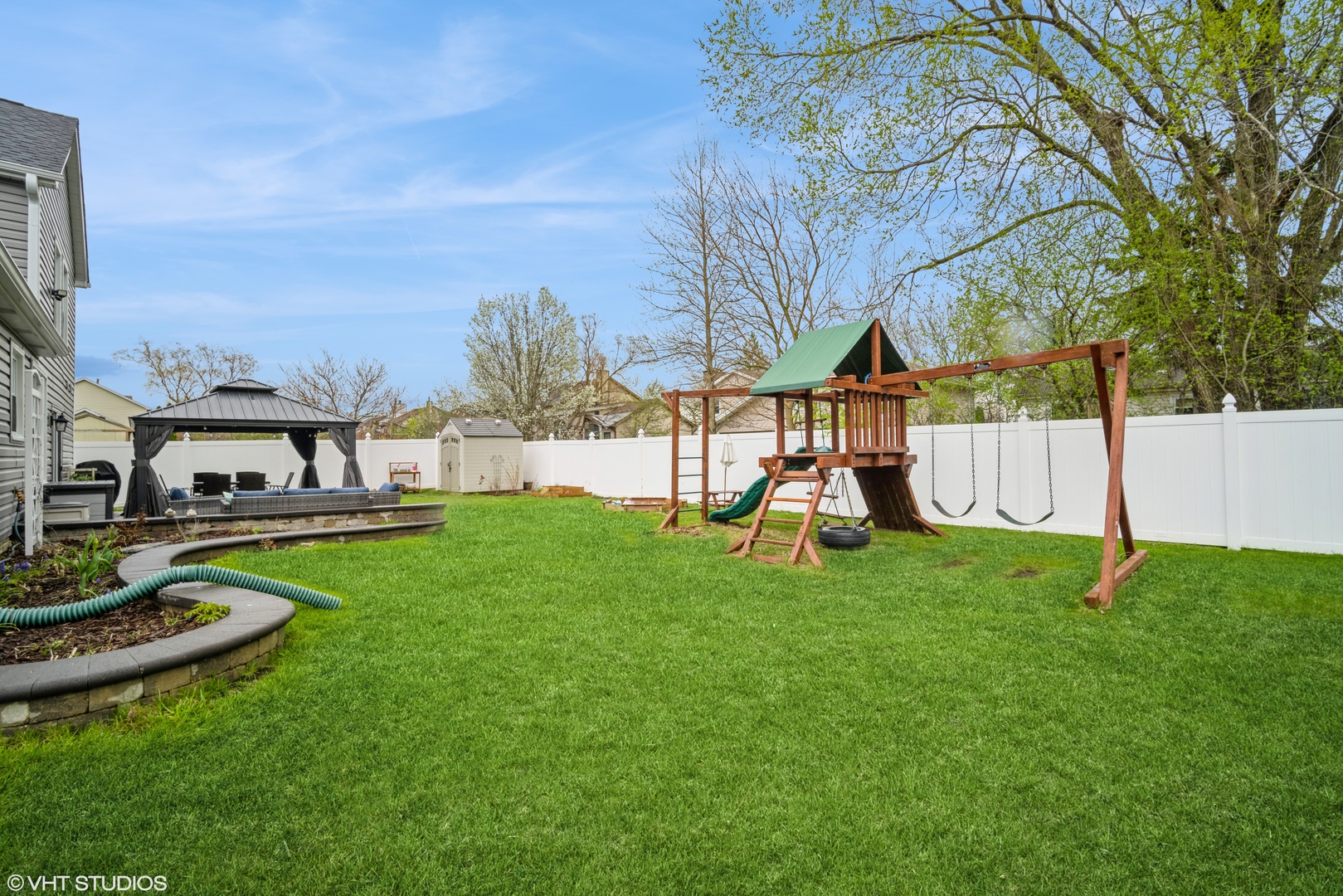 1145 John Drive Hoffman Estates, IL 60169 - Photo 36 of 36 a view of playground with a slide and swing
