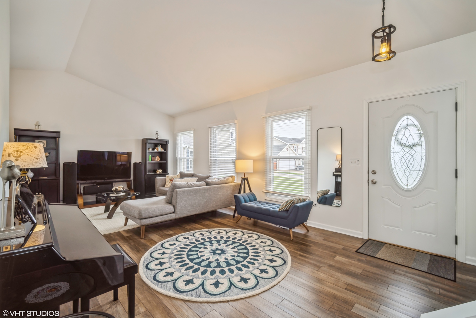 1145 John Drive Hoffman Estates, IL 60169 - Photo 5 of 36 a living room with furniture a rug and a large window