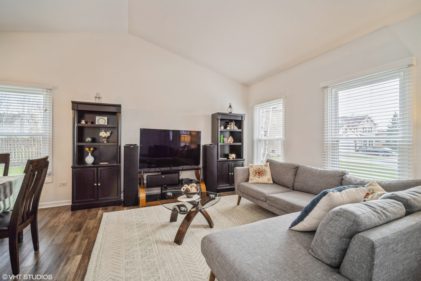 1145 John Drive Hoffman Estates, IL 60169 - Photo 6 of 36 a living room with furniture and a flat screen tv