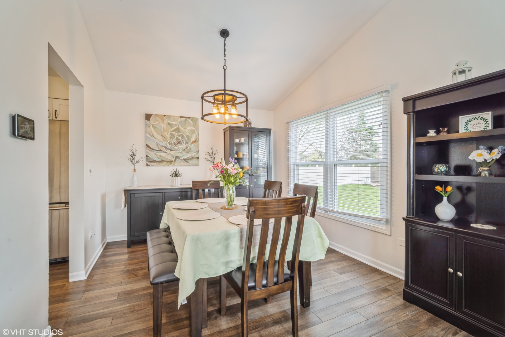 1145 John Drive Hoffman Estates, IL 60169 - Photo 7 of 36 a view of a dining room with furniture window and wooden floor