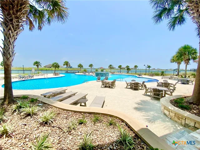 a view of a swimming pool and a yard