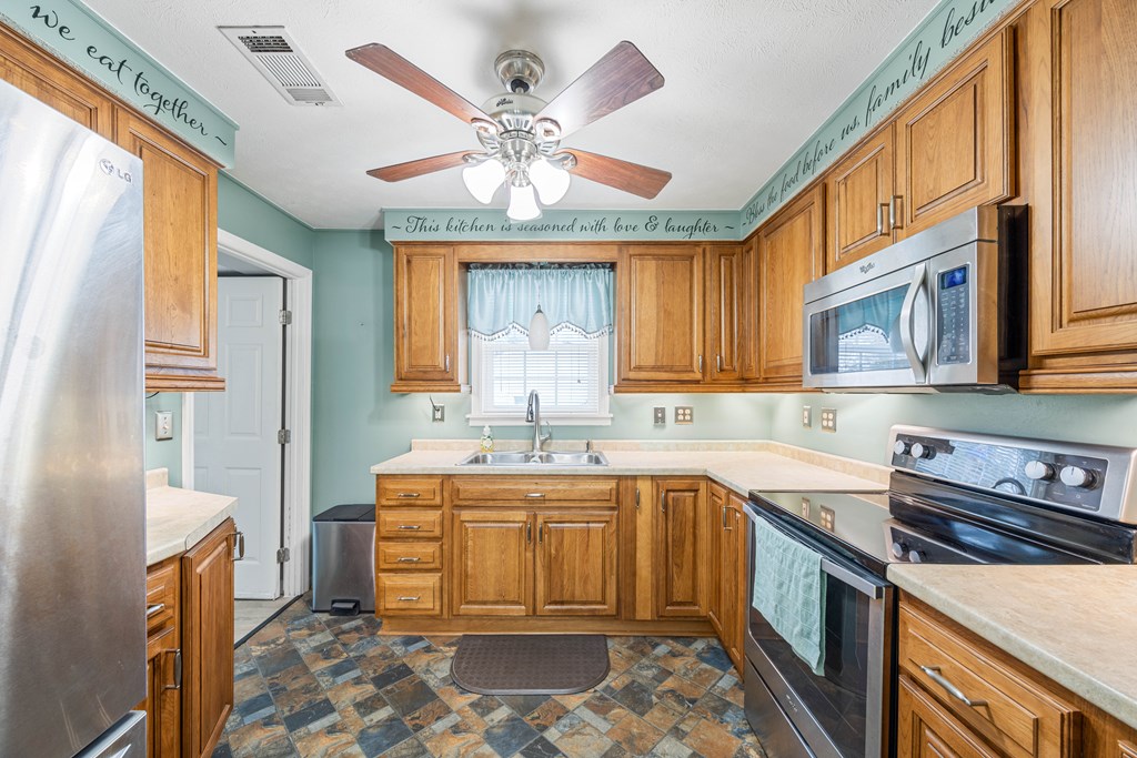 2103 Terrace Drive Columbus, GA 31904 - Photo 5 of 15 a kitchen with a sink appliances and cabinets