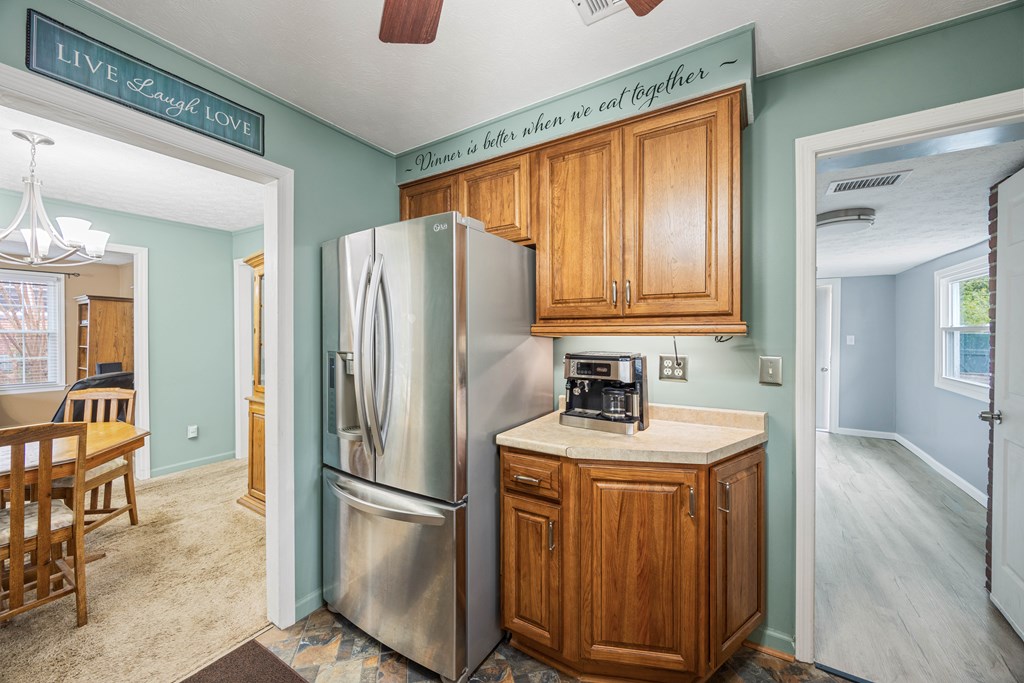 2103 Terrace Drive Columbus, GA 31904 - Photo 6 of 15 a kitchen with a refrigerator a sink and cabinets