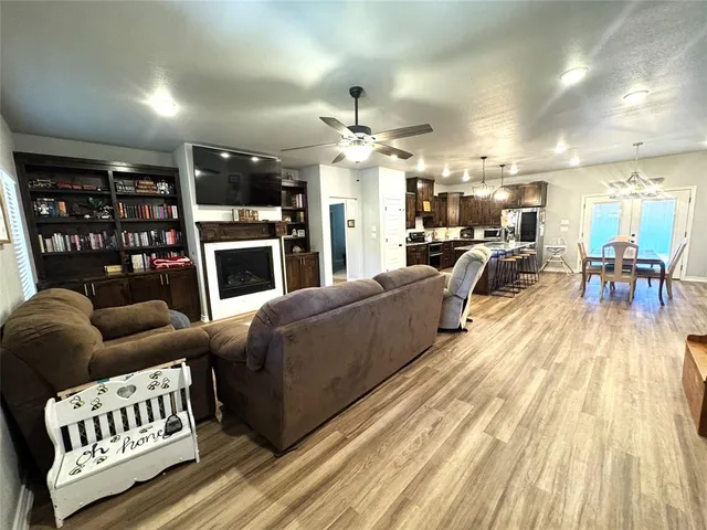 a living room with furniture fireplace and flat screen tv