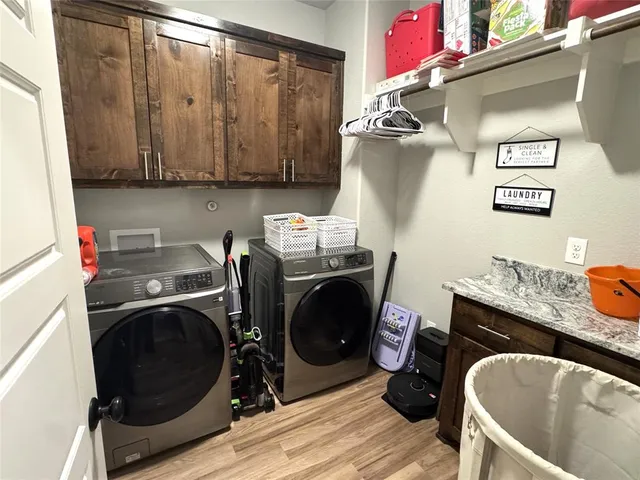 a storage room with washer and dryer