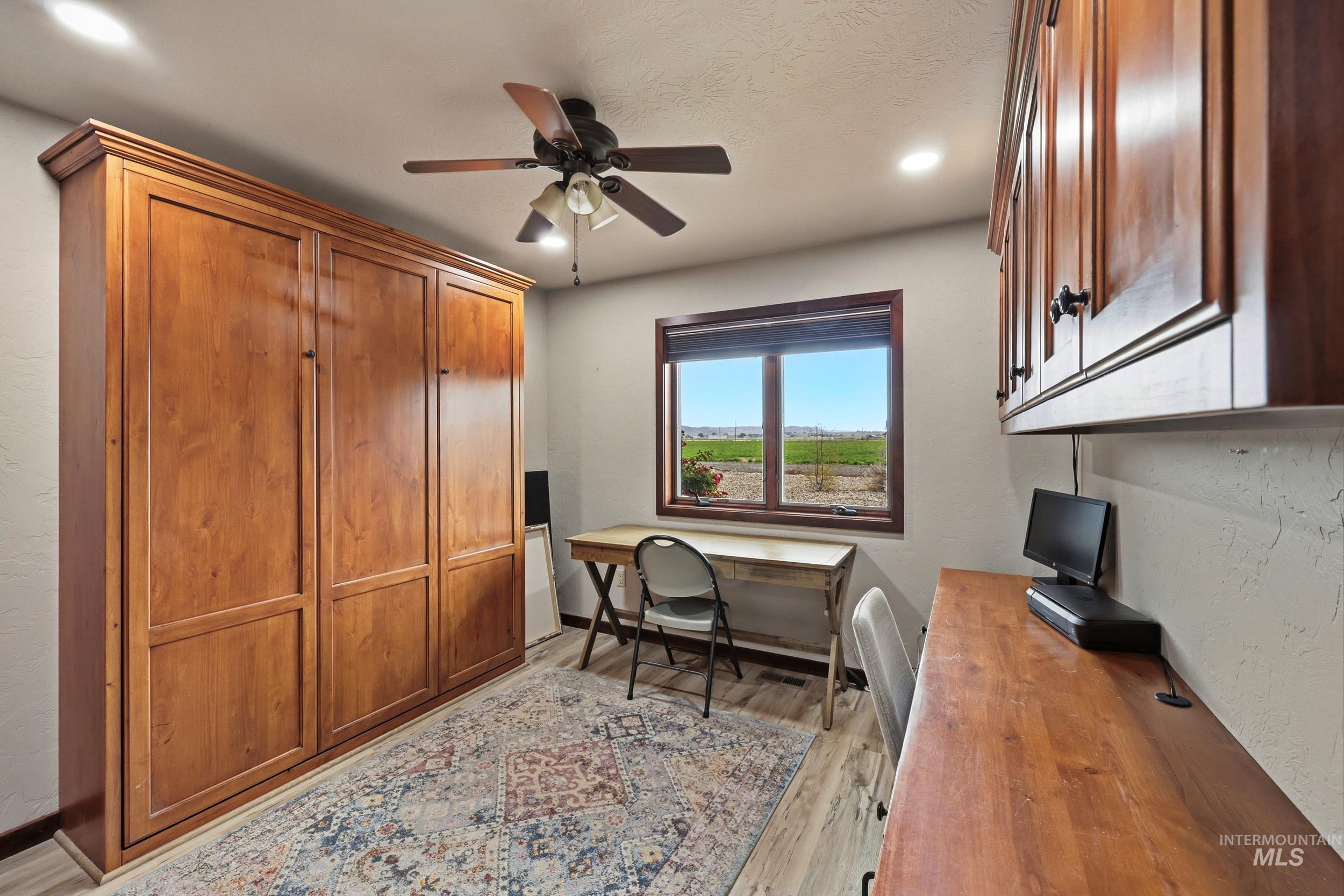 339 Airport Road Weiser, ID 83672 - Photo 16 of 49 Built-in wood-paneled cabinetry with crown molding and recessed lighting