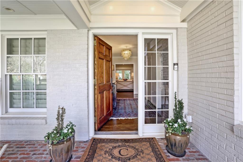 a view of front door of house with potted plant