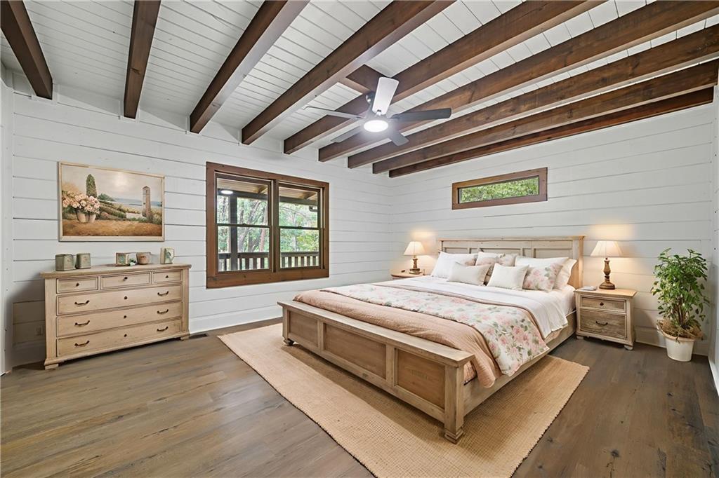 509 East Valley Road Northeast Rydal, GA 30171 - Photo 12 of 27 a large bed sitting in a bedroom next to a window