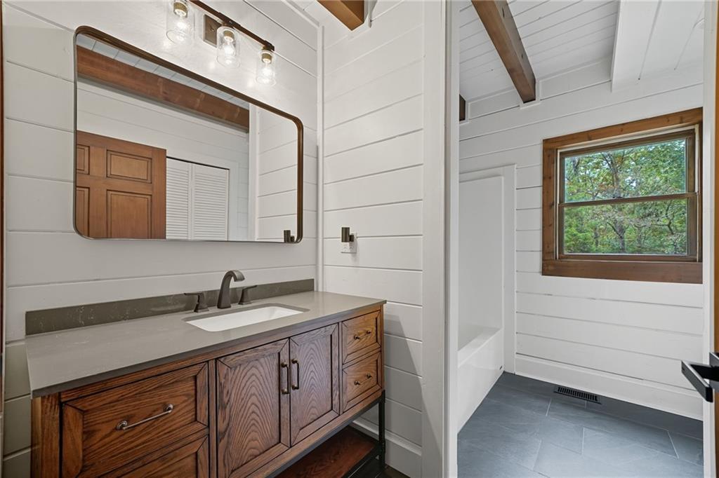 509 East Valley Road Northeast Rydal, GA 30171 - Photo 13 of 27 a bathroom with a sink and a mirror