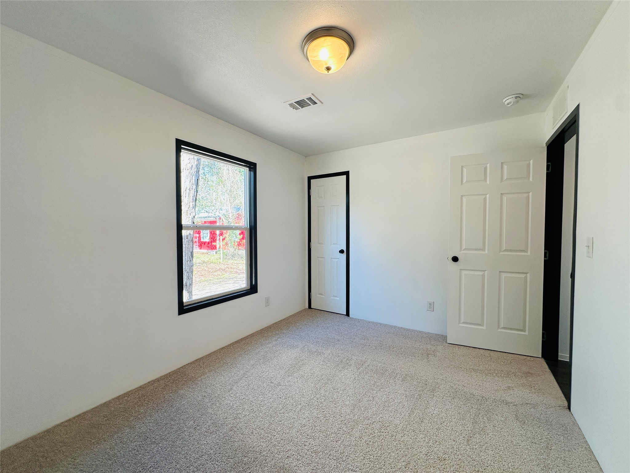 145 Campbell Street Shepherd, TX 77371 - Photo 15 of 36 a view of an empty room with a window