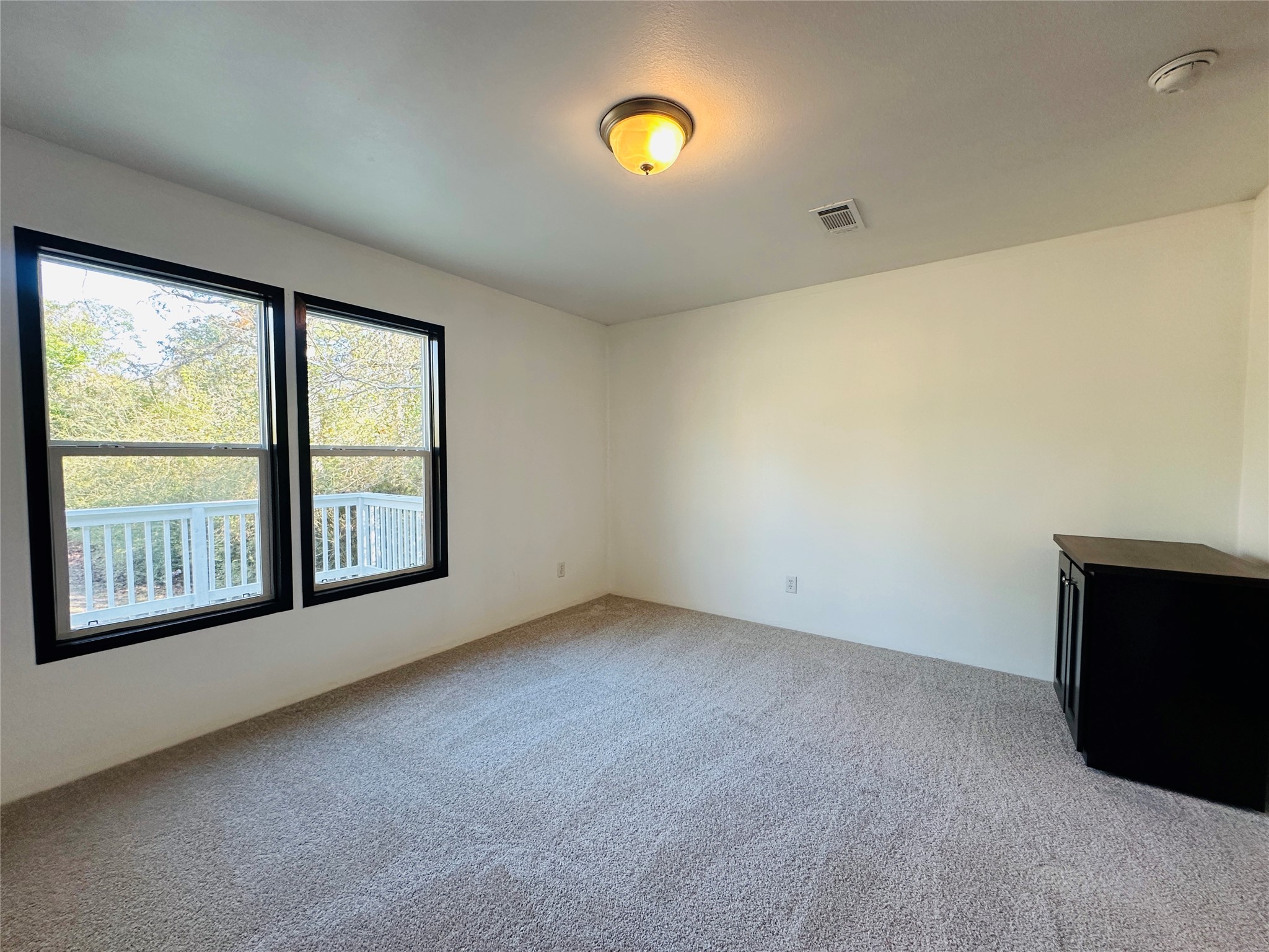 145 Campbell Street Shepherd, TX 77371 - Photo 18 of 36 an empty room with windows