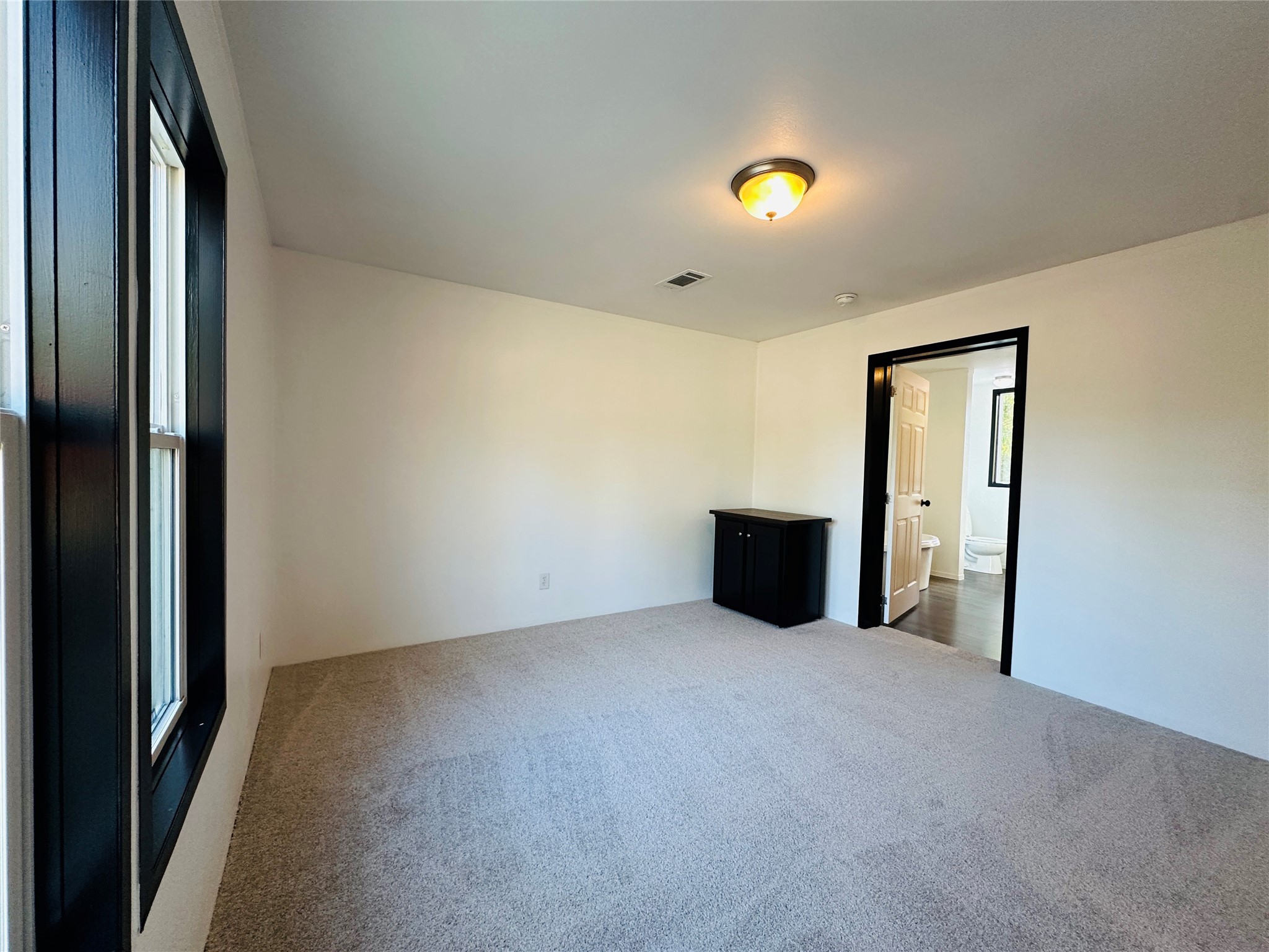 145 Campbell Street Shepherd, TX 77371 - Photo 19 of 36 a view of an empty room with a window