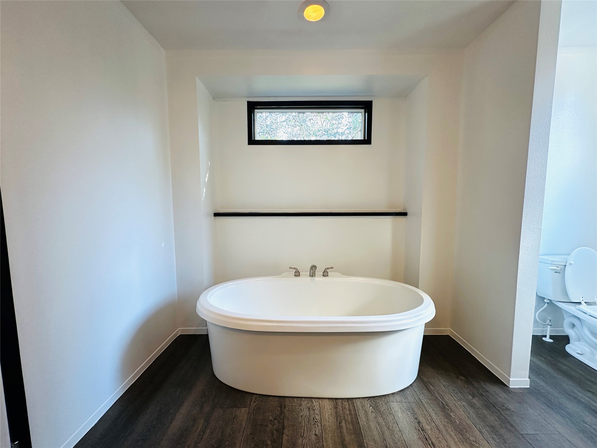 145 Campbell Street Shepherd, TX 77371 - Photo 25 of 36 a bathroom with a toilet and a sink