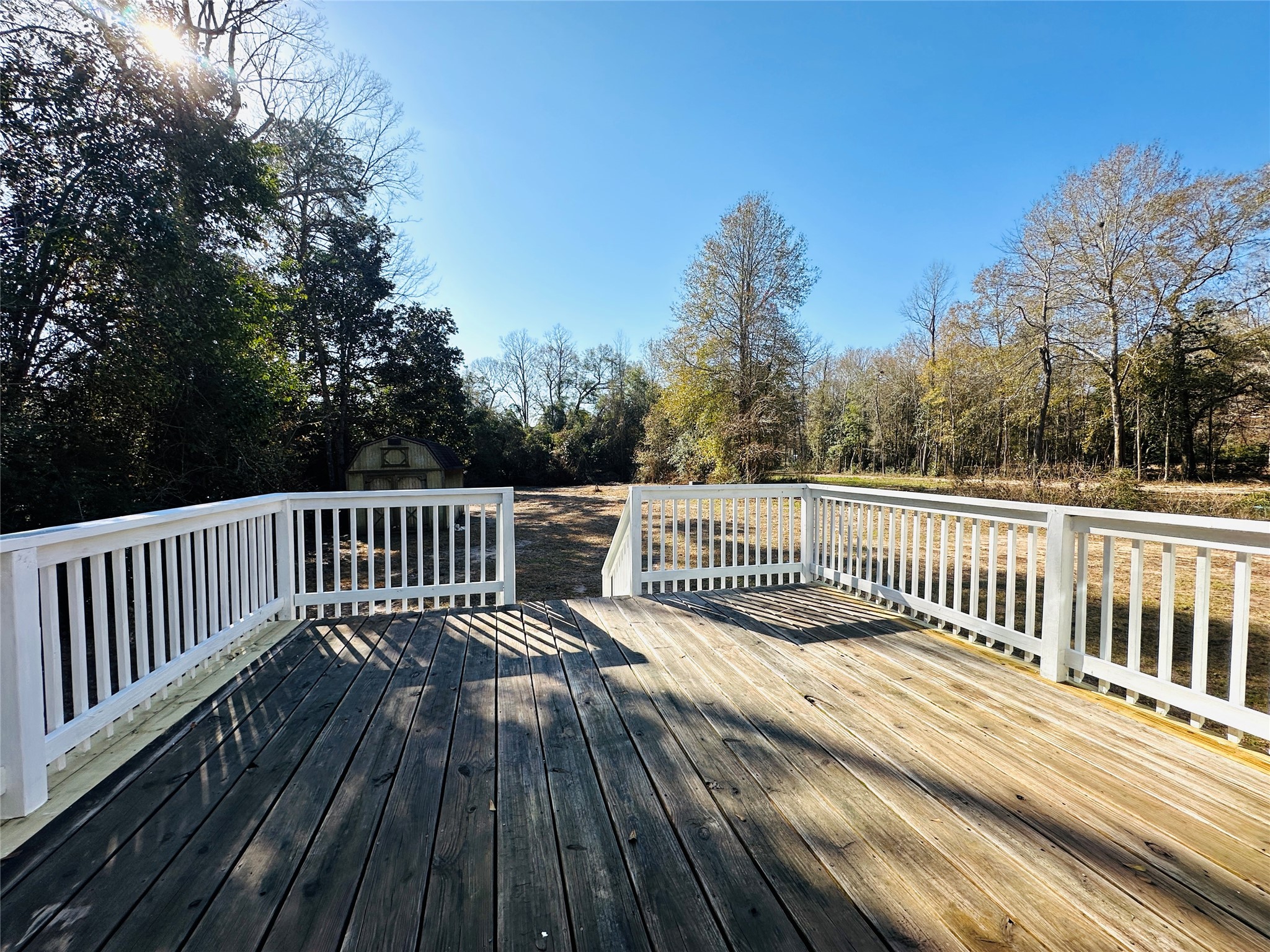 145 Campbell Street Shepherd, TX 77371 - Photo 26 of 36 a view of a wooden roof deck