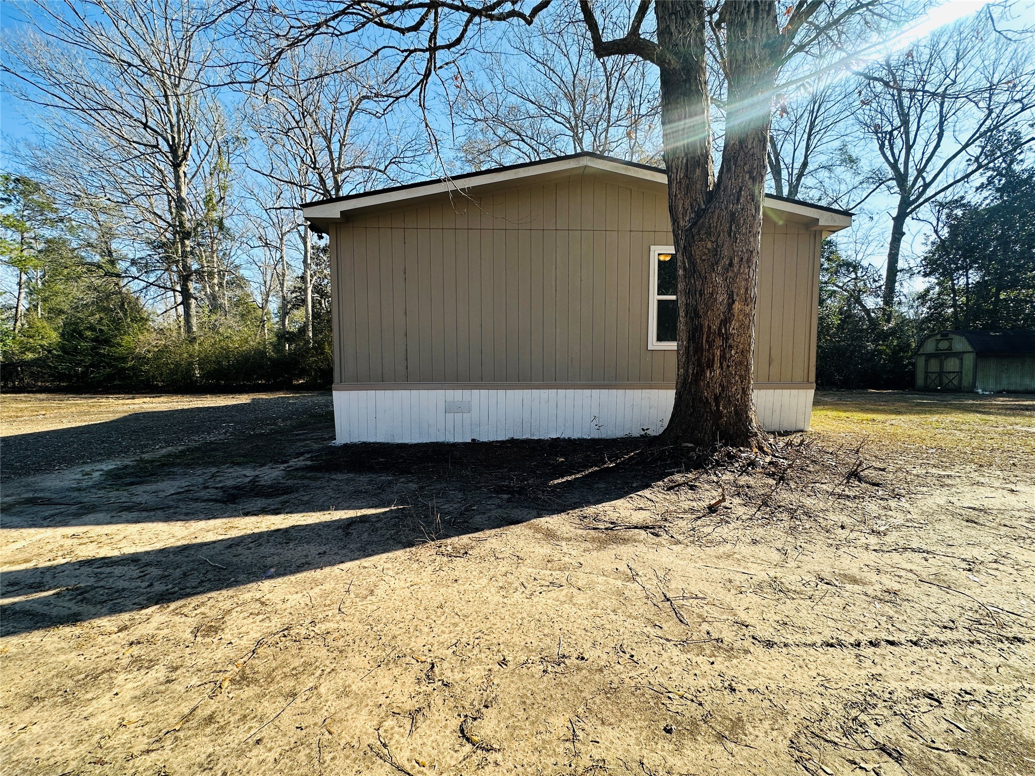 145 Campbell Street Shepherd, TX 77371 - Photo 30 of 36 a view of a backyard of the house