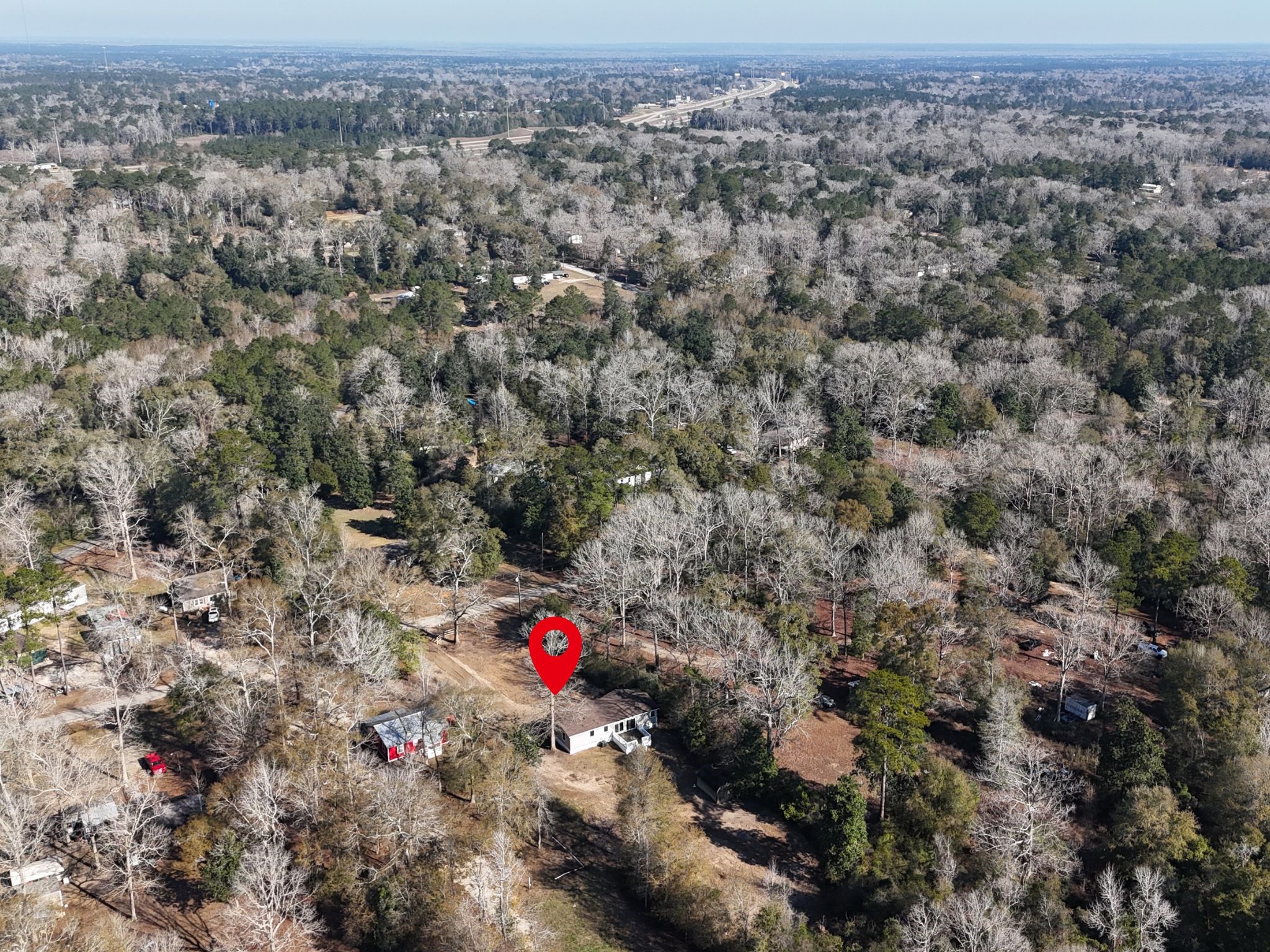 145 Campbell Street Shepherd, TX 77371 - Photo 36 of 36 an aerial view of red and white house